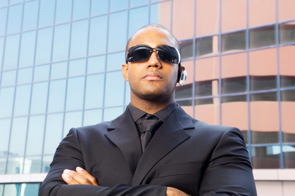 a-personal-security-guard-arms-folded-2026-01-11-09-52-06-utc